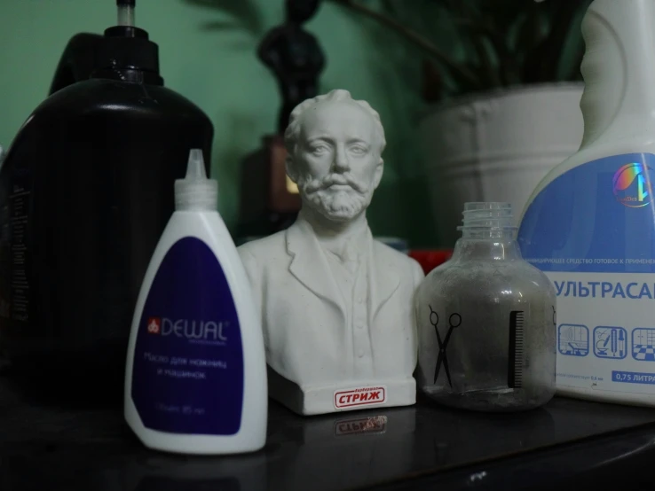 a shelf with several bottles and items on it