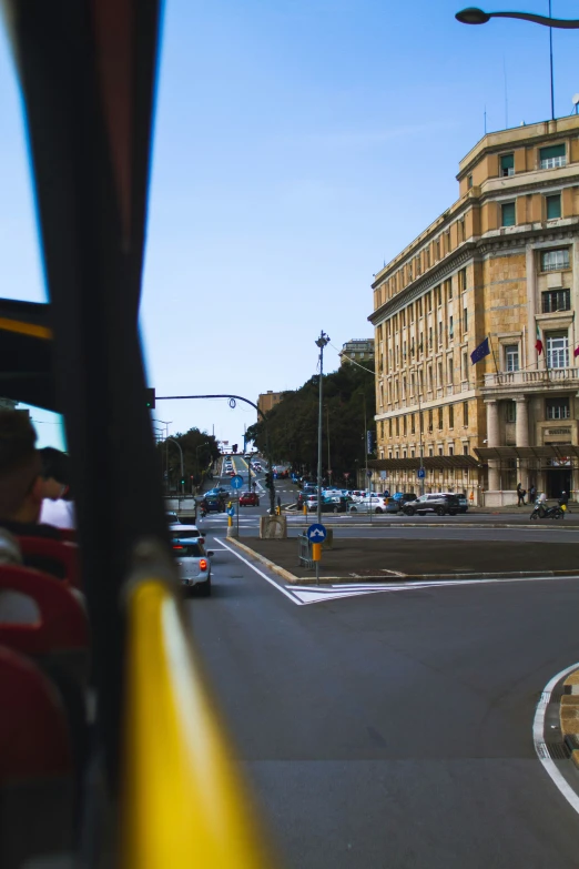 a city bus with it's driver behind it's back window