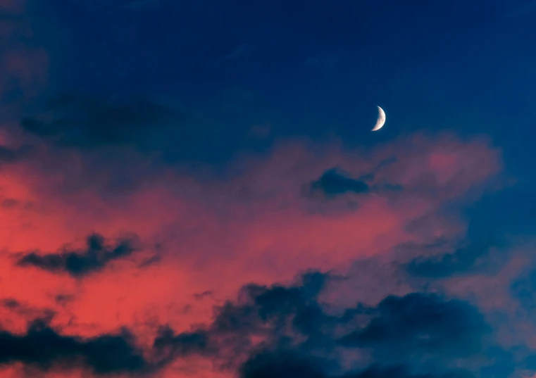 a crescent eclipse in the sky as seen from an apartment