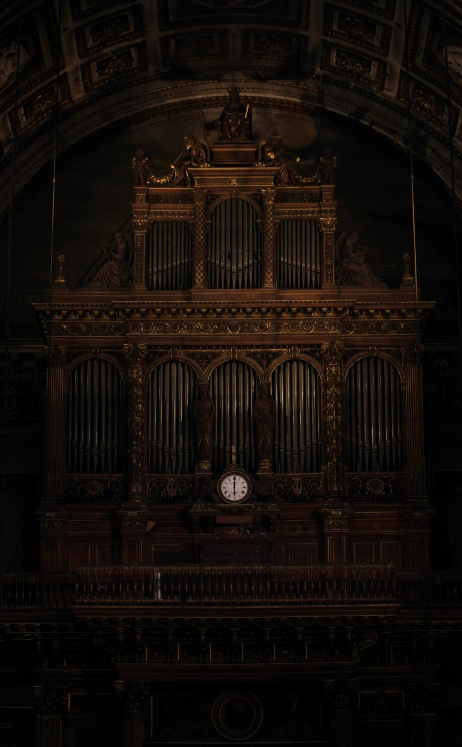 an old pipe organ is lit by the light from behind