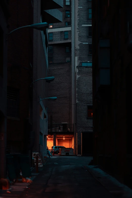 a city street with an illuminated tunnel in the middle