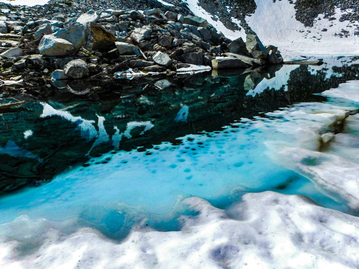 the mountain is completely covered in snow and water