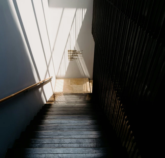 a staircase is shown with sunlight coming through