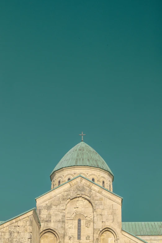 an image of a church spire with a green roof