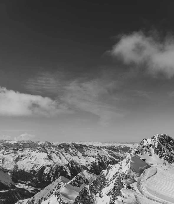 a man on a ski slope in the mountains