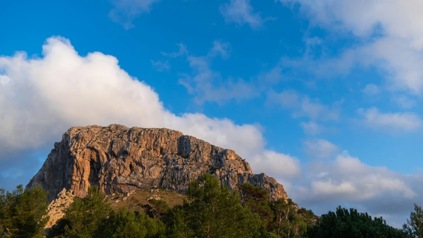 an image of the top of a rock on the mountain