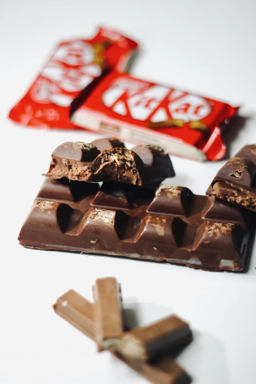 candy and some chocolate sticks laying on a table