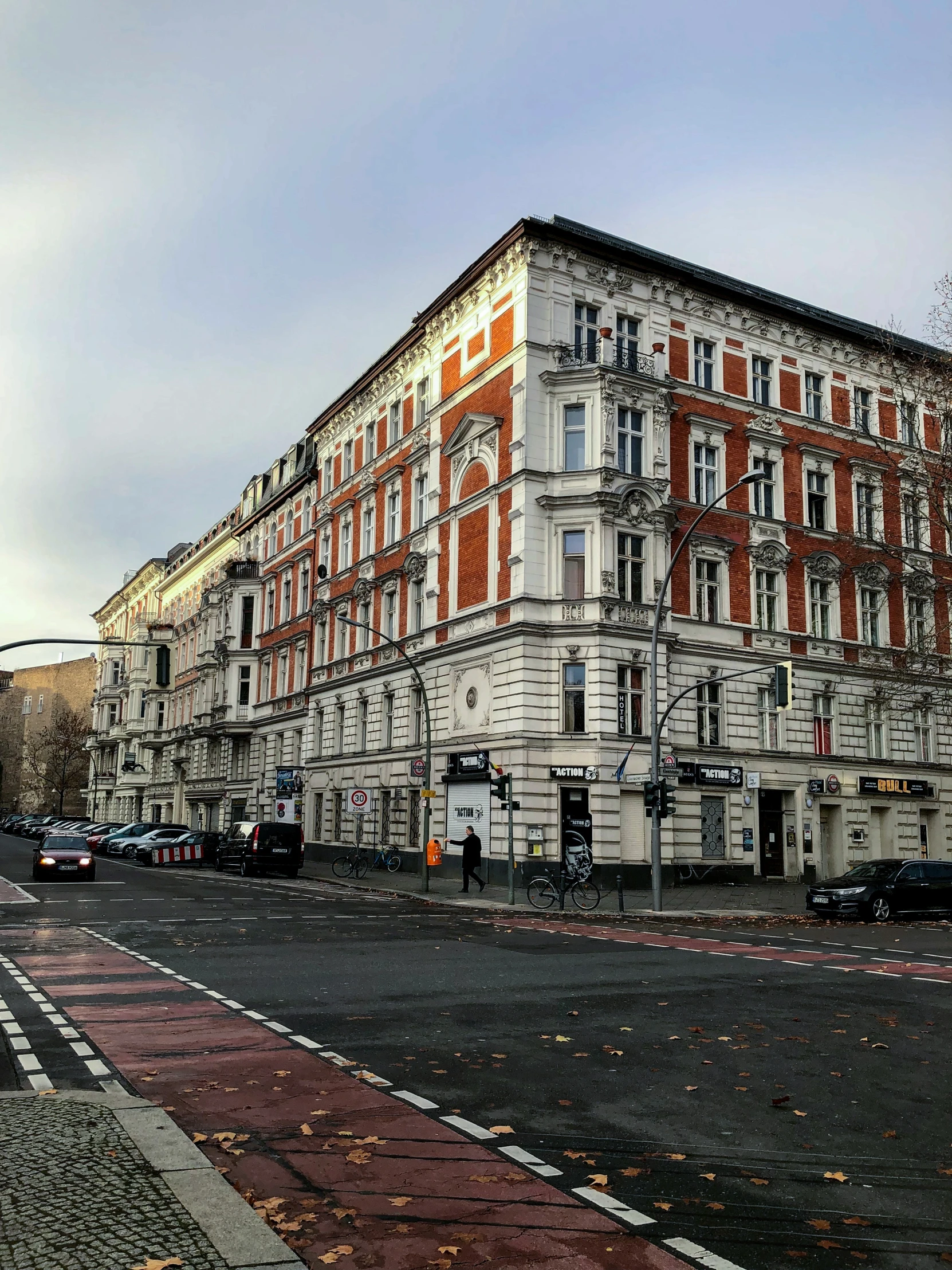 an old brick building stands next to a road