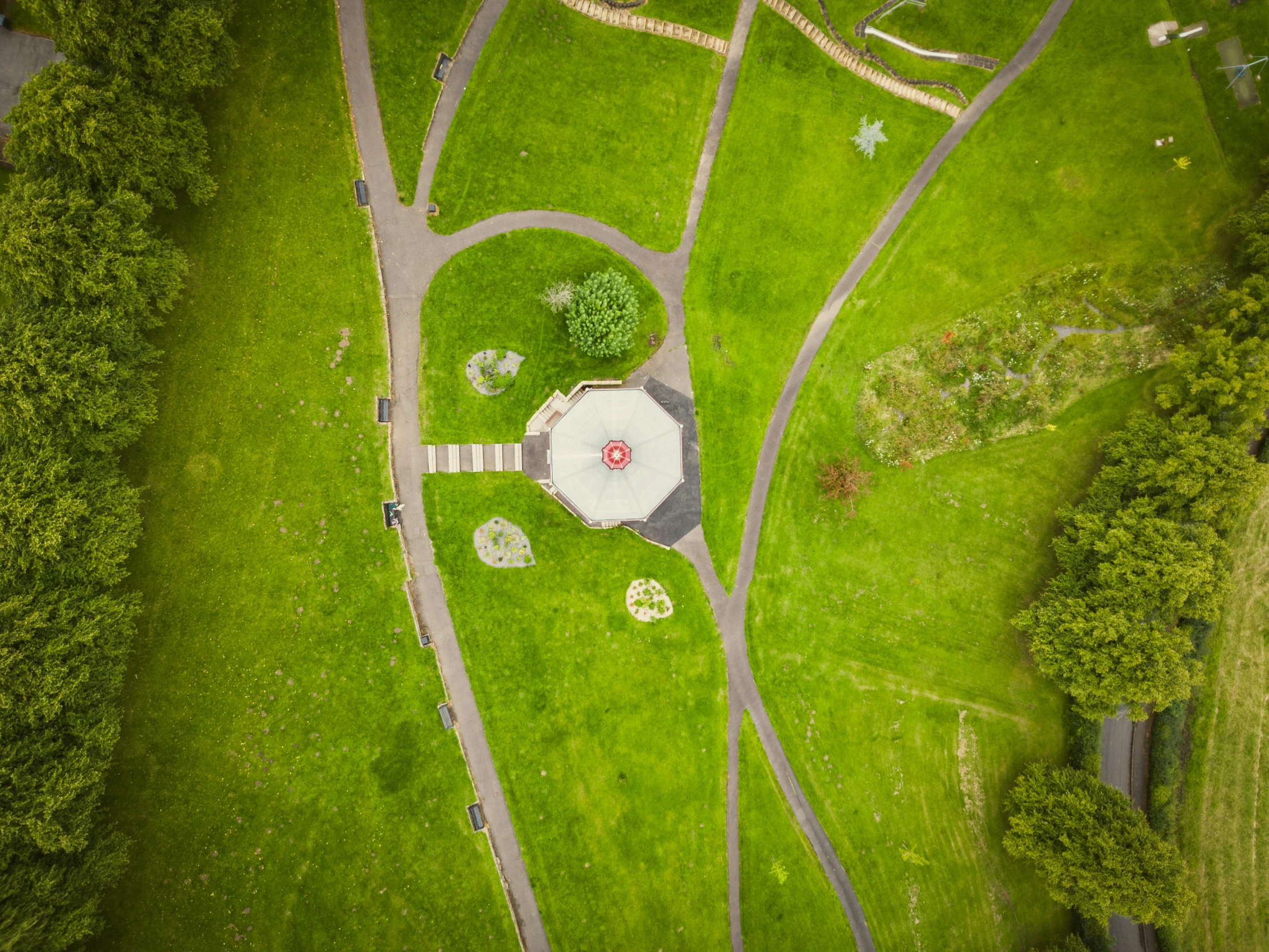 an aerial view of a large grassy field