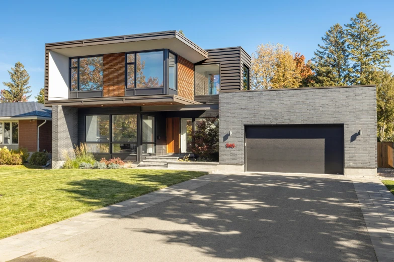 an expansive, modern home in a suburban neighborhood