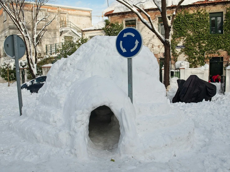 a tunnel constructed into the ground in the snow