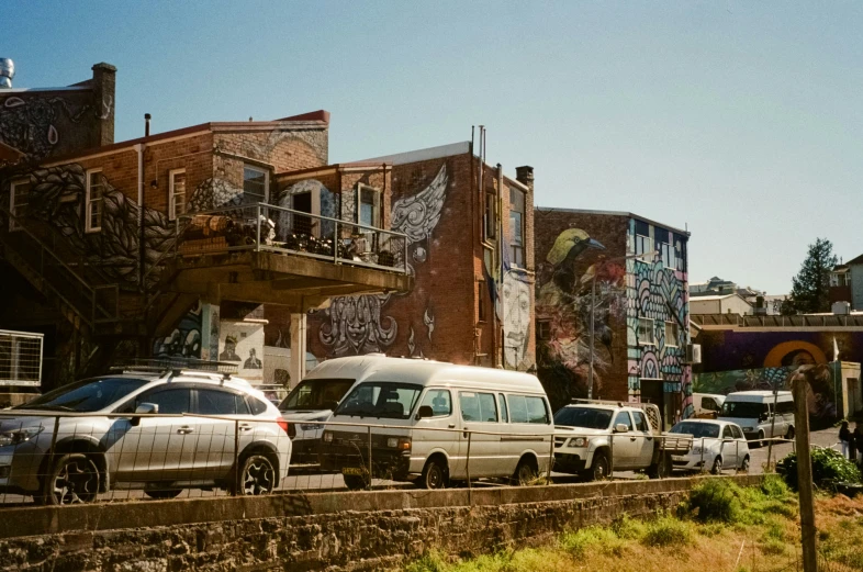 several cars that are parked in front of a building