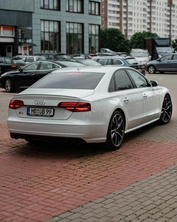 a white car sits in the parking lot