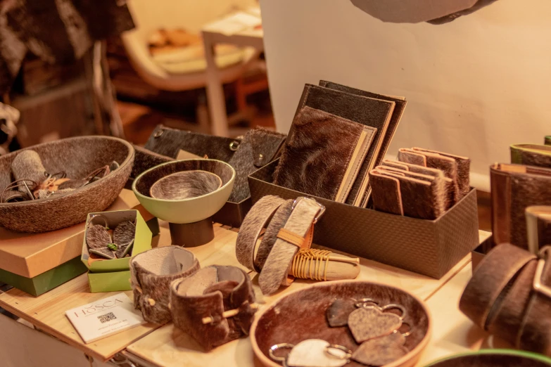 a bunch of brown plates and bowls on top of a table