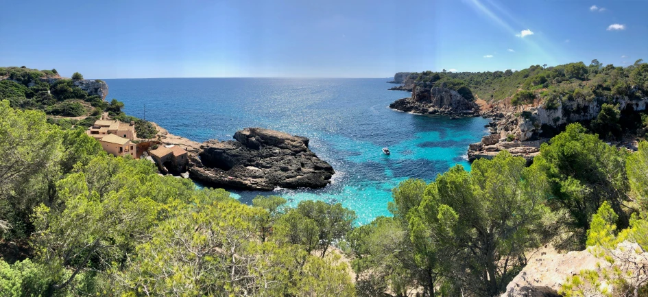 a view of a body of water through some trees