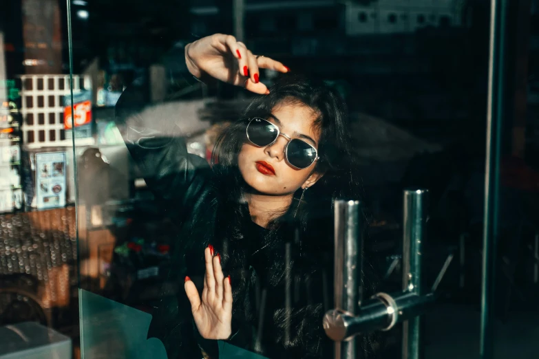 a woman putting her hands into her hair