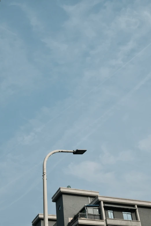 a very tall building under a blue sky