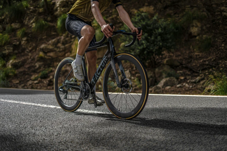 a guy riding a bike on a road