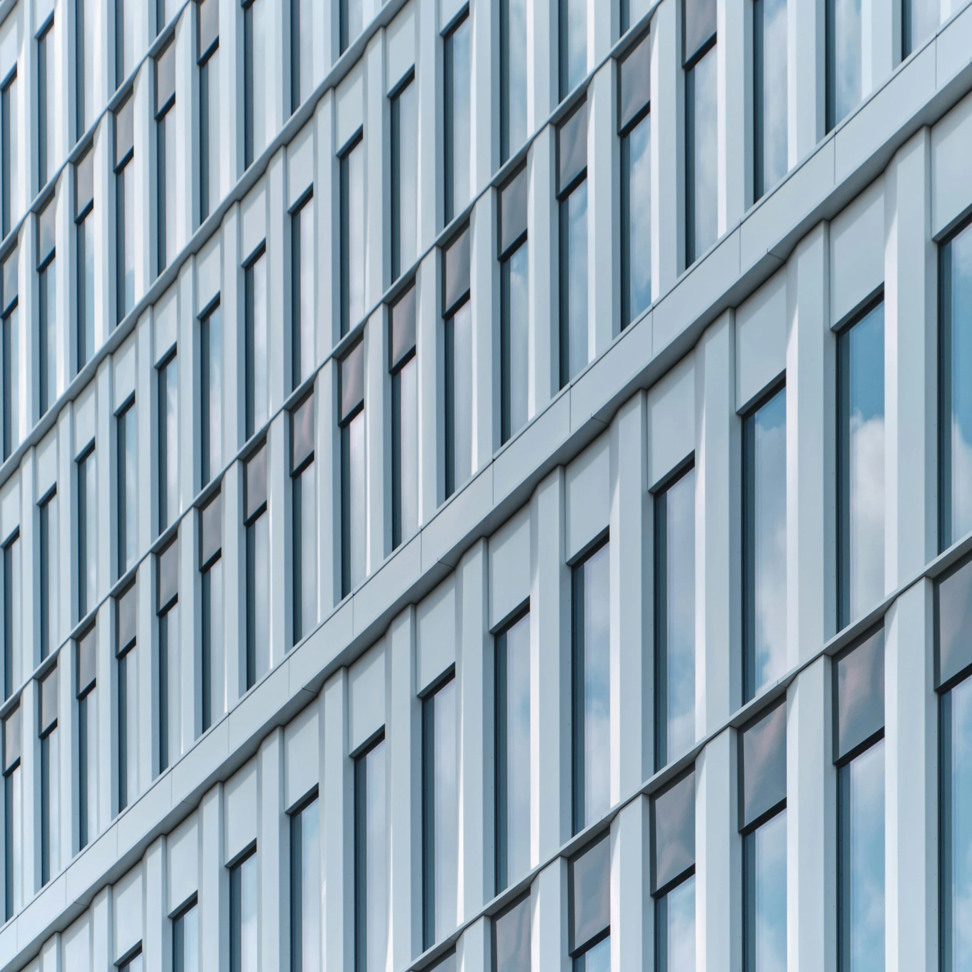 the facade of an office building with many windows