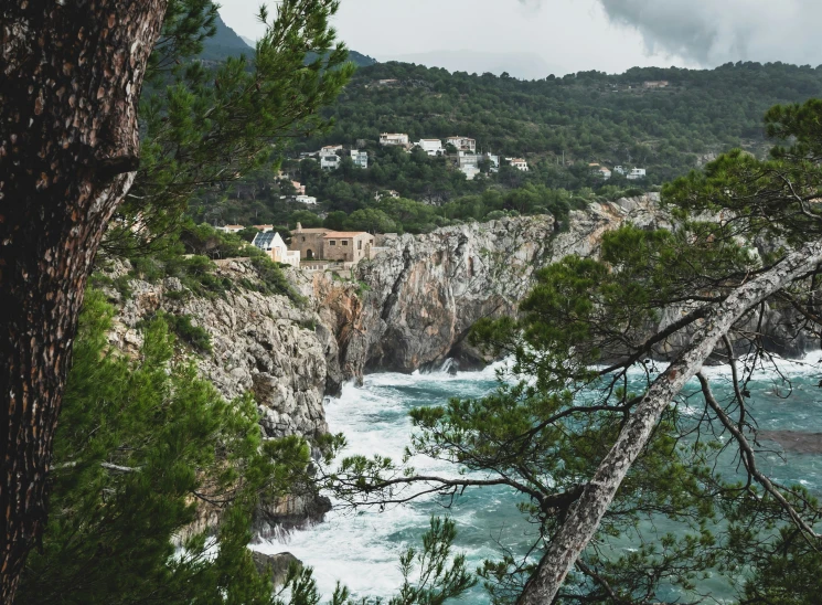 a very pretty view of a ocean coast and a big cliff