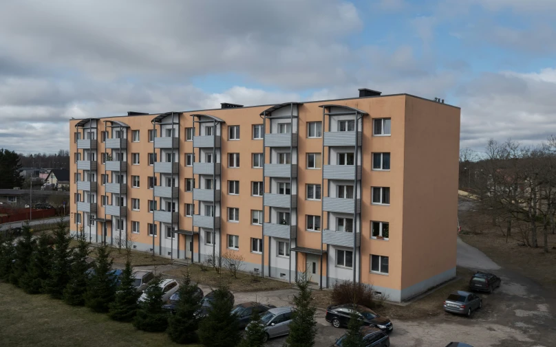 a large, two - story apartment building is shown with many windows