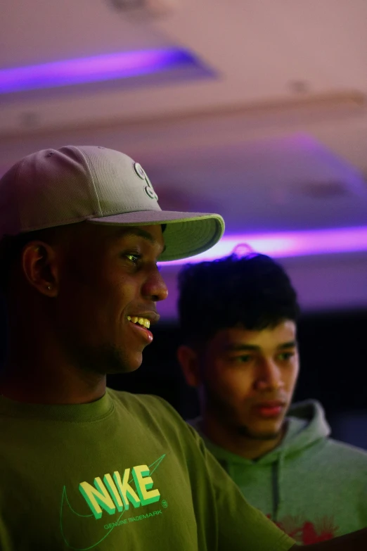 two men wearing matching nike jackets and hats