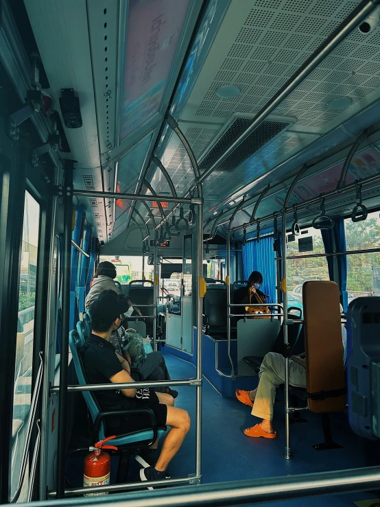 a man is sitting in a public transportation