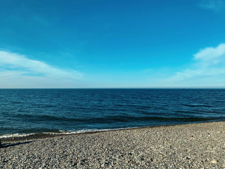 a blue ocean that has a large body of water on it