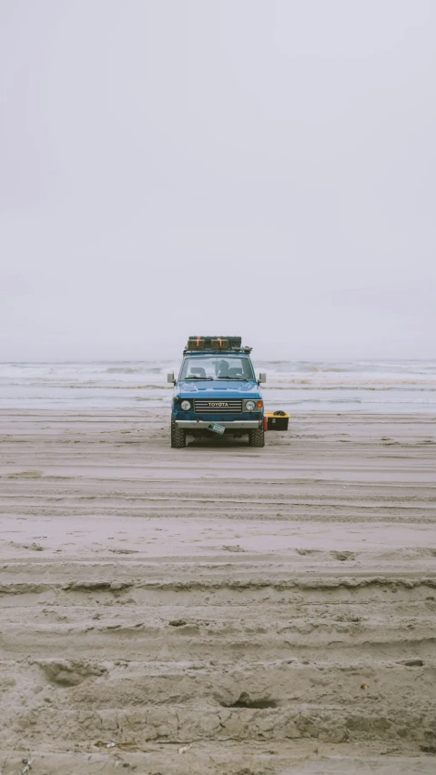 a truck that is sitting in the sand