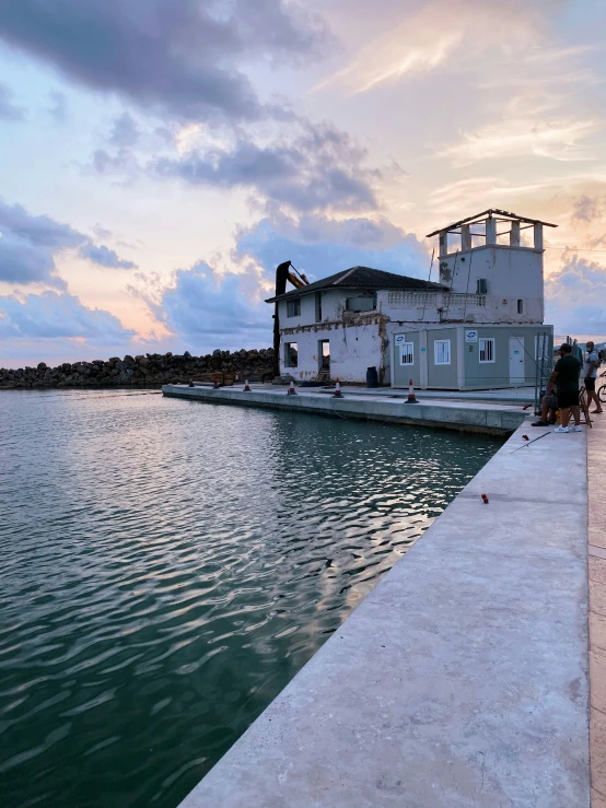 this house sits on an island with a boat dock