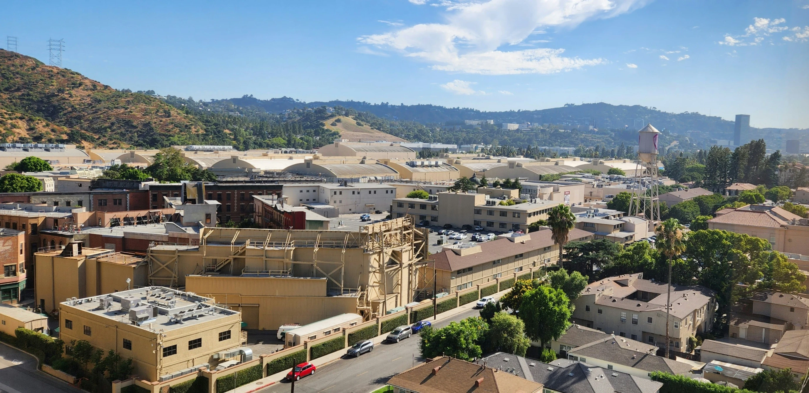 a large city view with a hill in the background