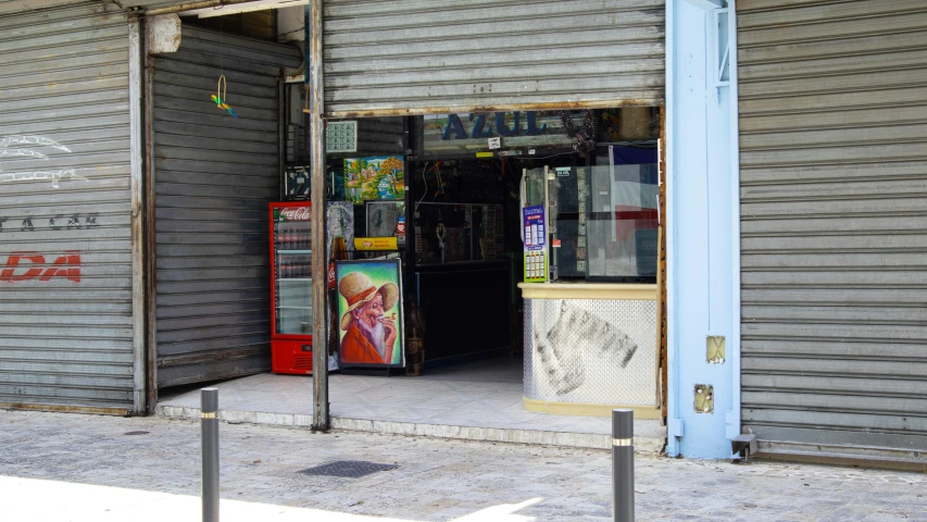 a vending machine is outside near two closed door