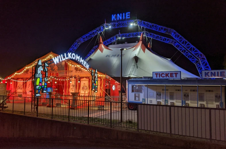 a circus tent and entrance with lights