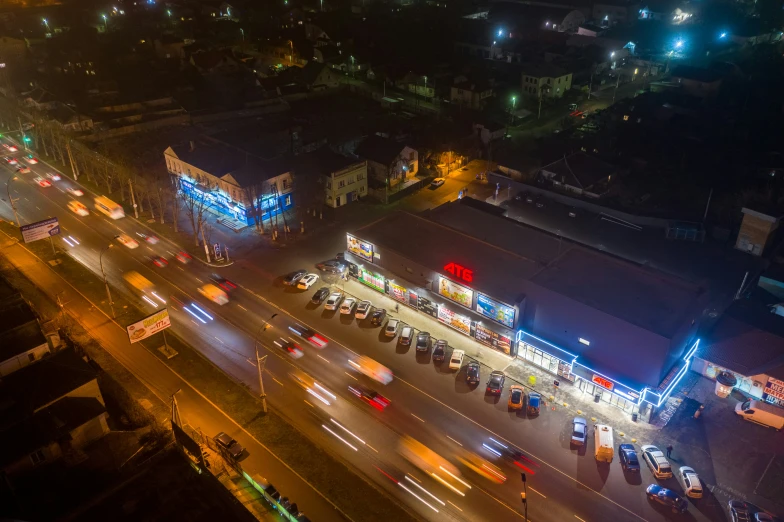 the city street with the lights at night is crowded