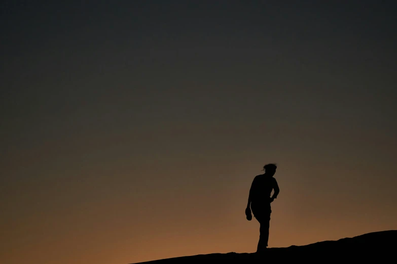 a person standing on top of a hill