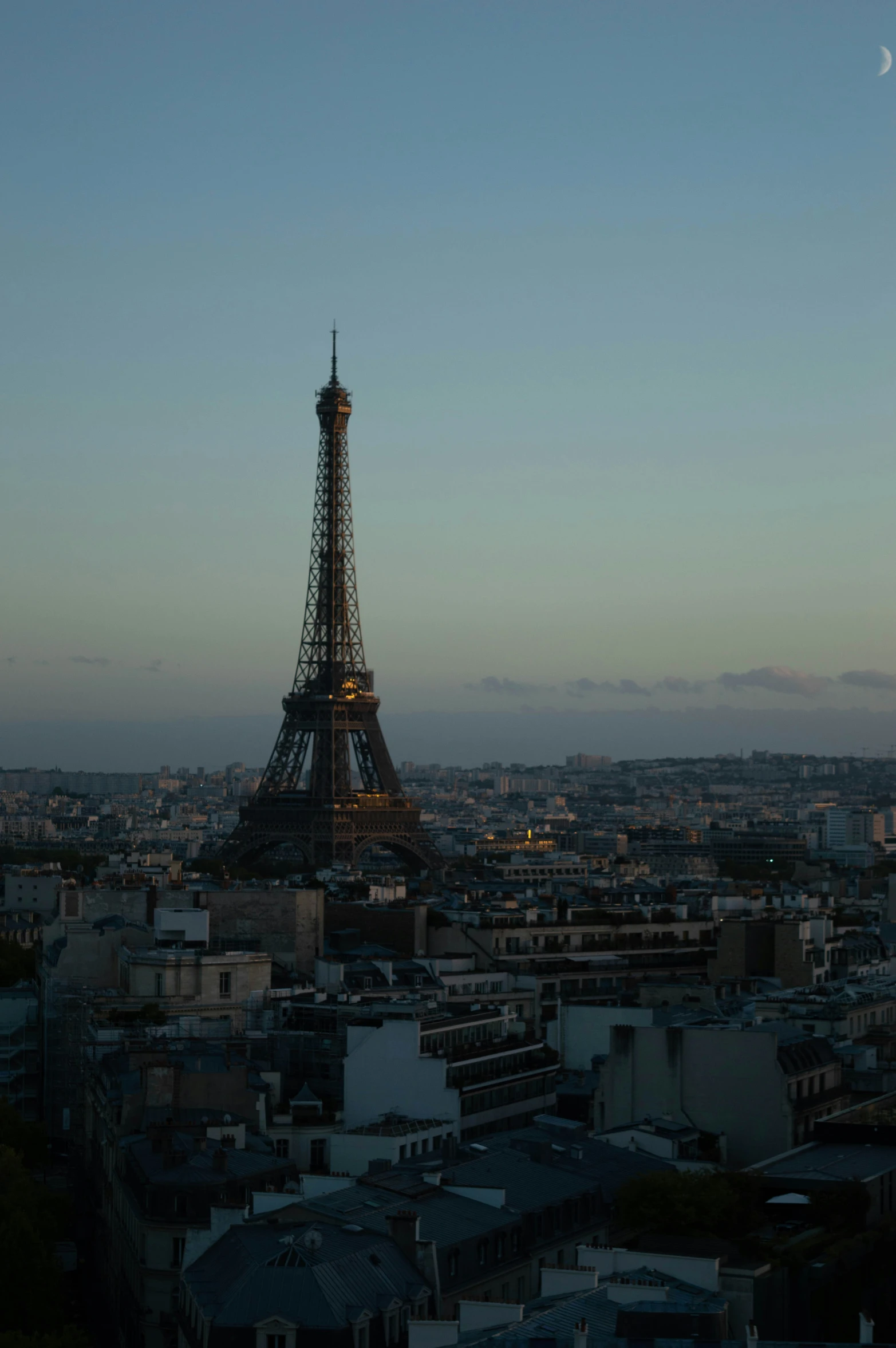 the eiffel tower lit up at night during the daytime