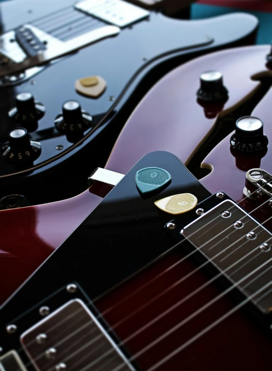 an electric guitar with several different s laying on it