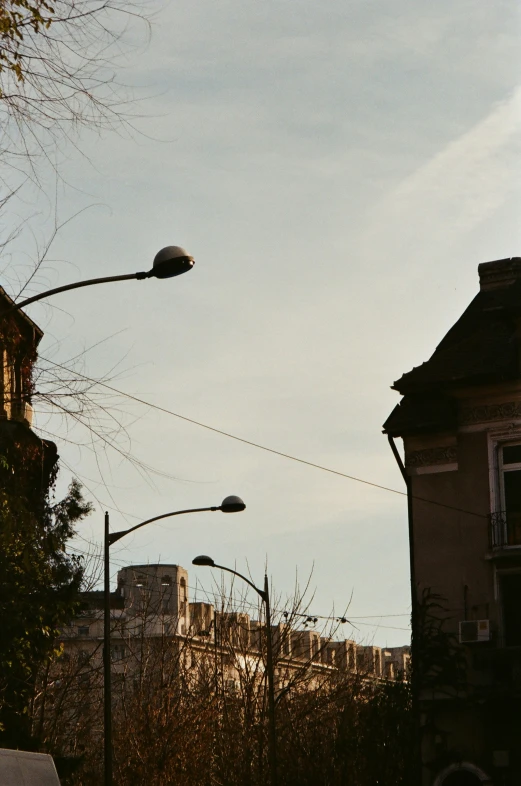 a street light with trees in the background