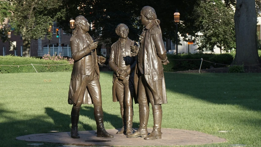 a statue is shown of two men standing with each other