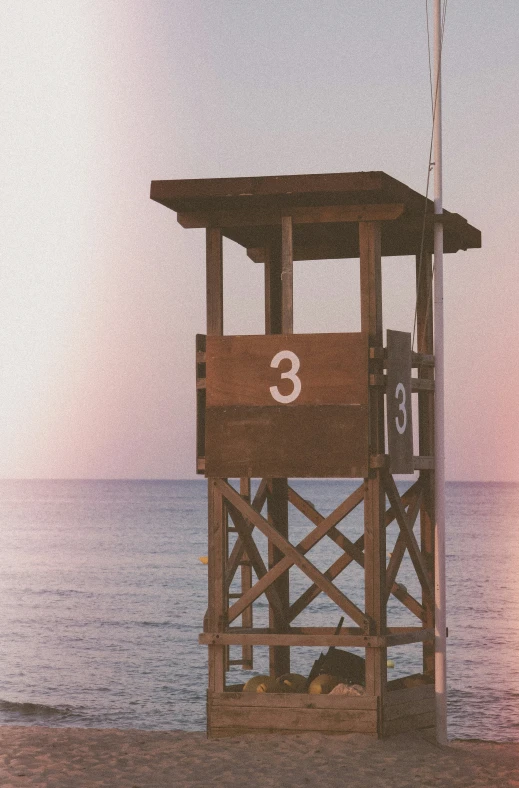 a lifeguard station at the end of a beach