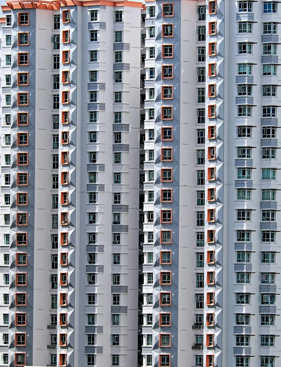 several tall apartment buildings in front of each other