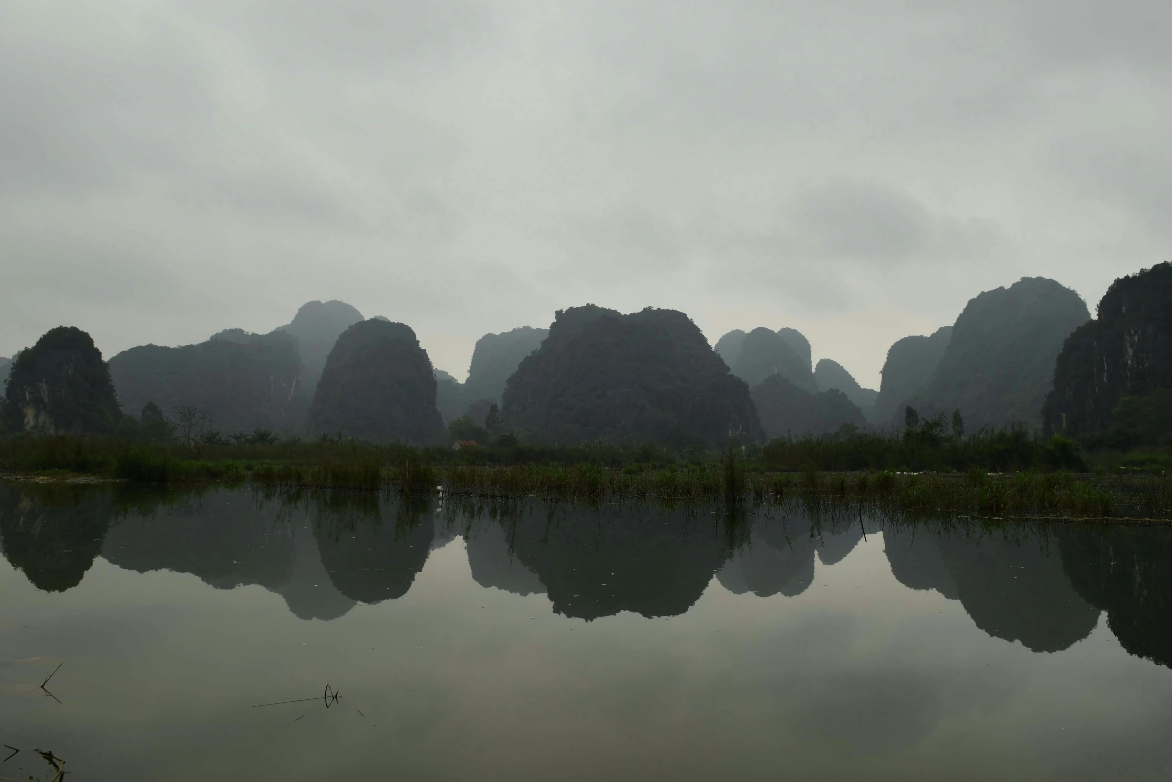 the mountains are reflected in a still lake