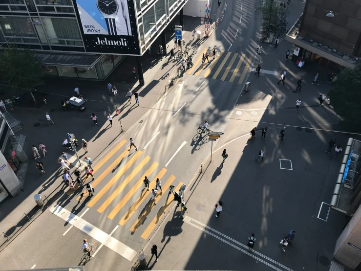 the street is crowded with people standing on it