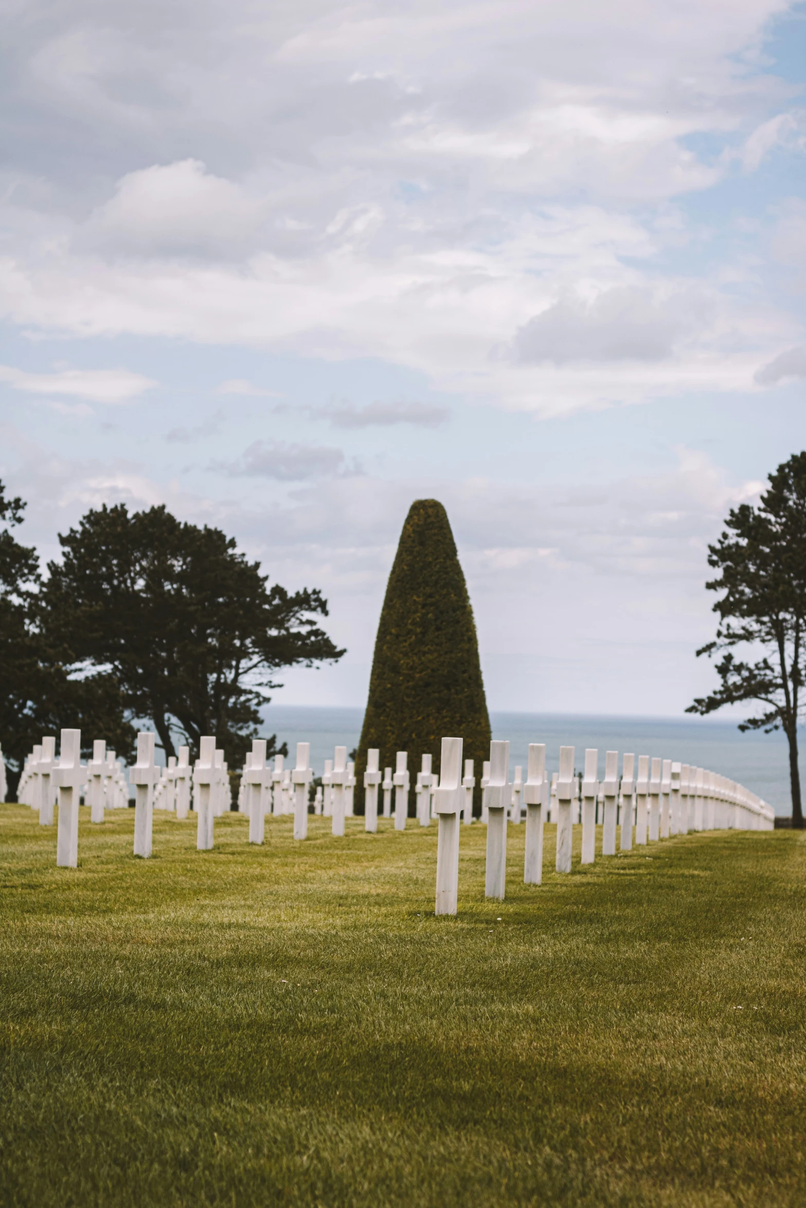 the american cemetery is covered with statues