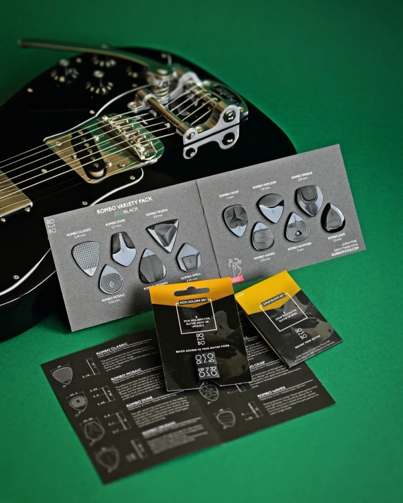 a guitar head, neck, and bridge with matching guitar repair tools