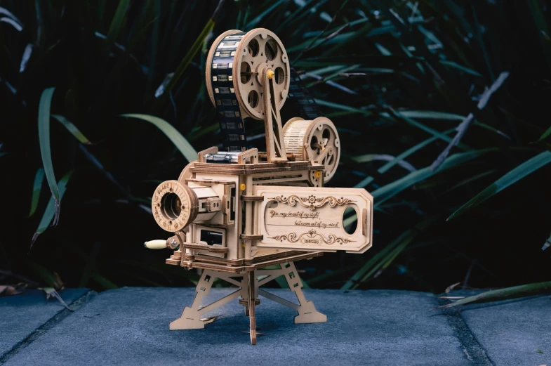 wooden model of a movie projector made from wood