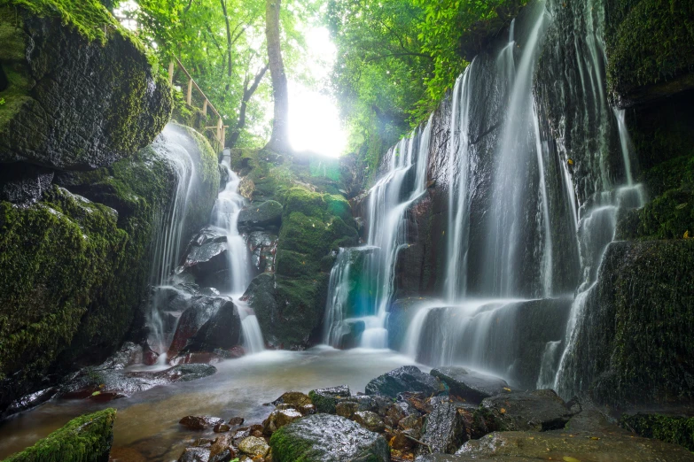 a very large waterfall that is surrounded by trees