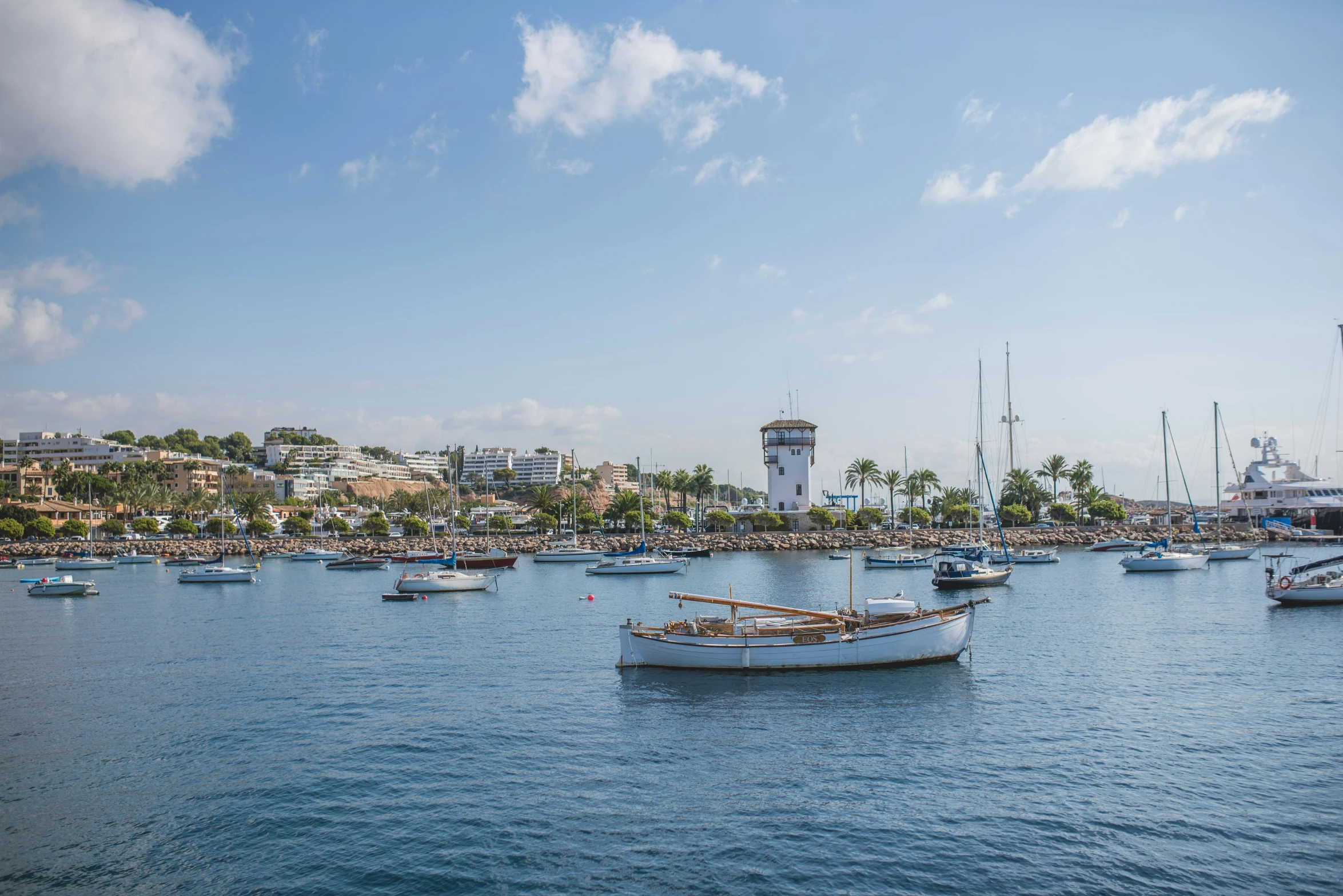 small boats floating on water and in the ocean