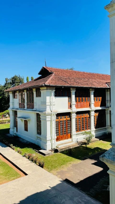 a building with some orange and red shutters