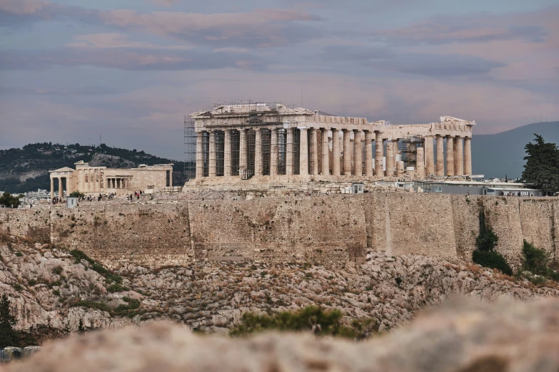 a large stone building sitting on top of a cliff